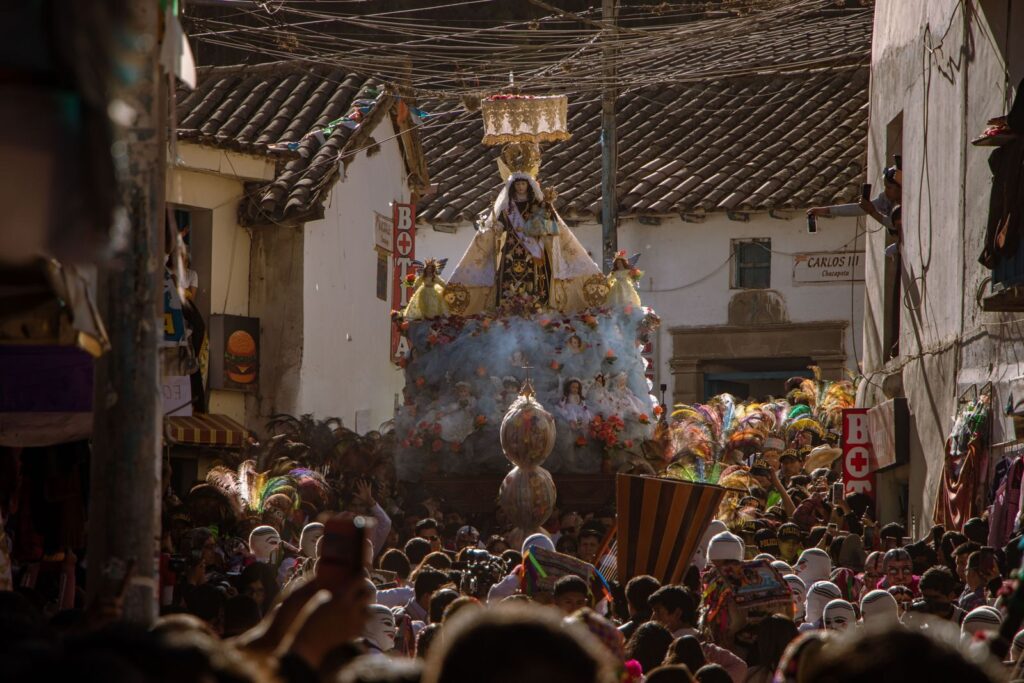 A colorful religious procession in Cusco, Peru, showcasing local culture and tradition.
