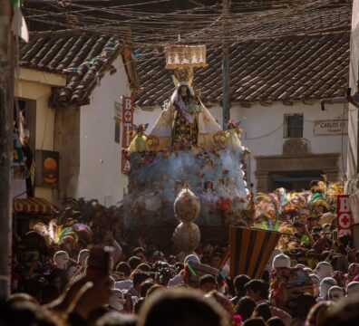 A colorful religious procession in Cusco, Peru, showcasing local culture and tradition.