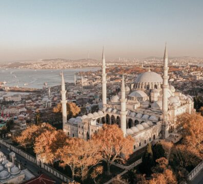 A stunning aerial shot of the Suleymaniye Mosque and Istanbul cityscape at sunset, showcasing architectural beauty.