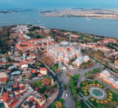 Breathtaking aerial view of Hagia Sophia and the Bosphorus in Istanbul, showcasing the city's iconic architecture and vibrant landscape.