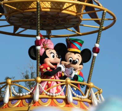 mickey mouse riding on swing ride
