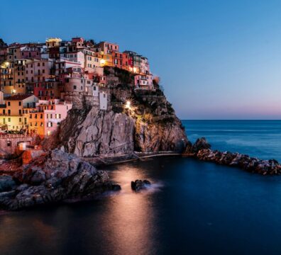 lighted houses near ocean