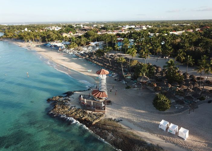 A stunning aerial view of Dominicus Beach with its iconic lighthouse in the Dominican Republic.