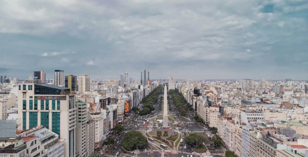 an aerial view of a city with tall buildings