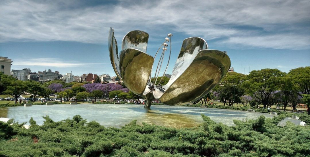 a large metal sculpture in the middle of a park